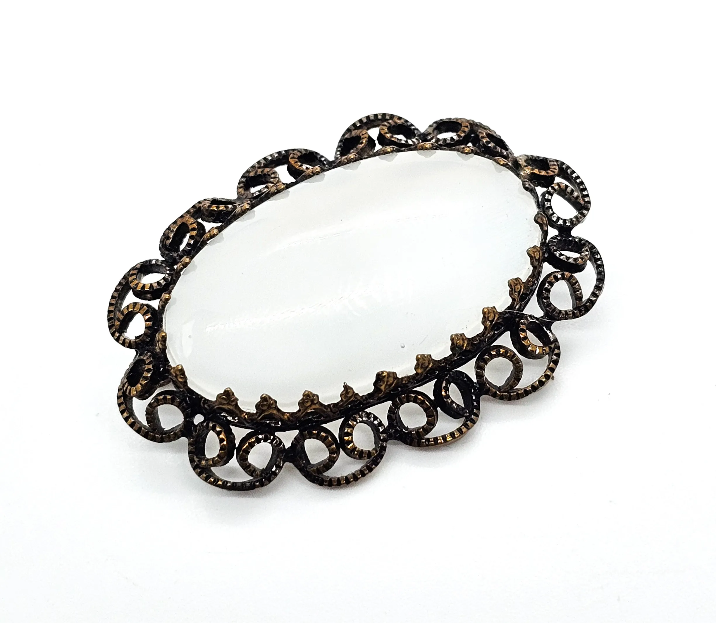 Austrian white Cat's Eye moonglow glass with filigree frame vintage brooch