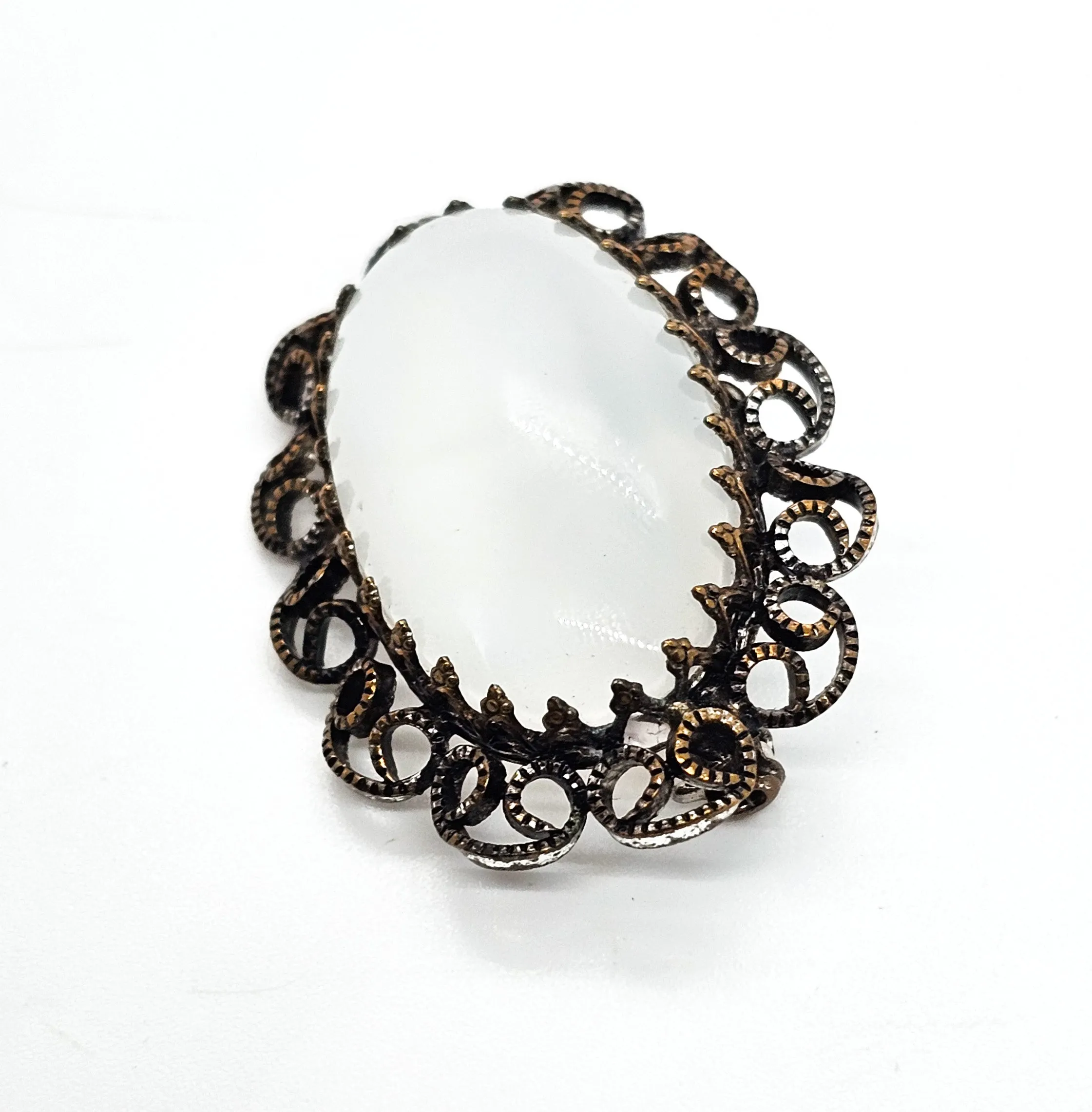 Austrian white Cat's Eye moonglow glass with filigree frame vintage brooch
