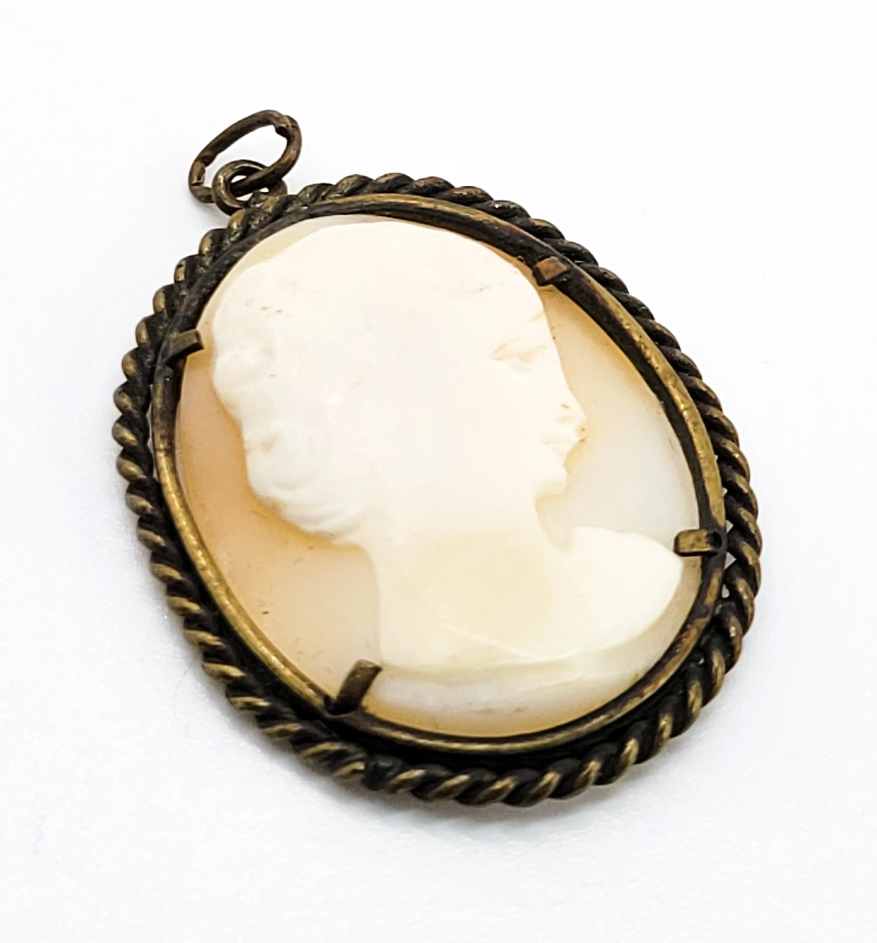 Carved shell right facing vintage woman cameo pendant in twisted rope brass setting
