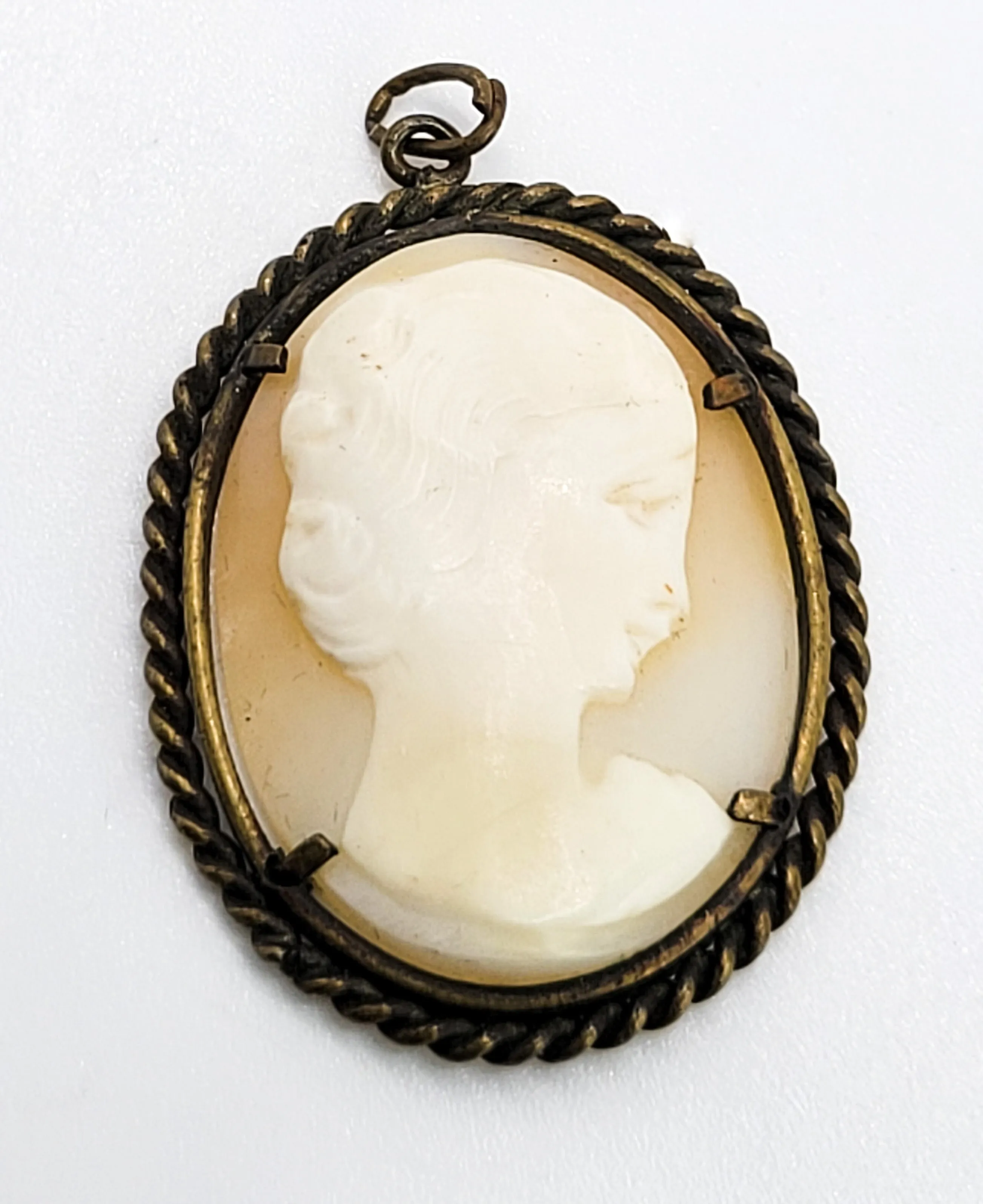 Carved shell right facing vintage woman cameo pendant in twisted rope brass setting
