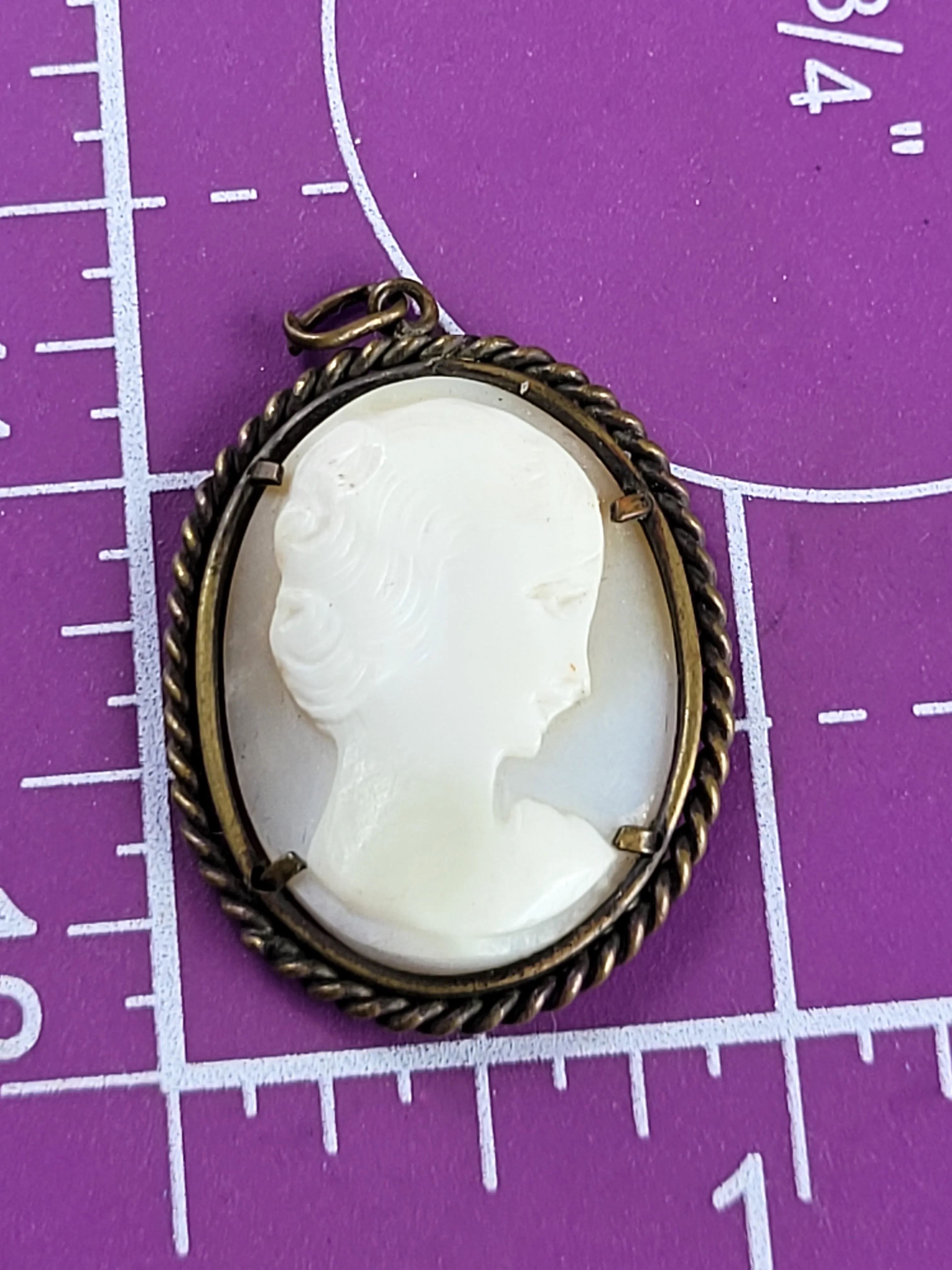 Carved shell right facing vintage woman cameo pendant in twisted rope brass setting