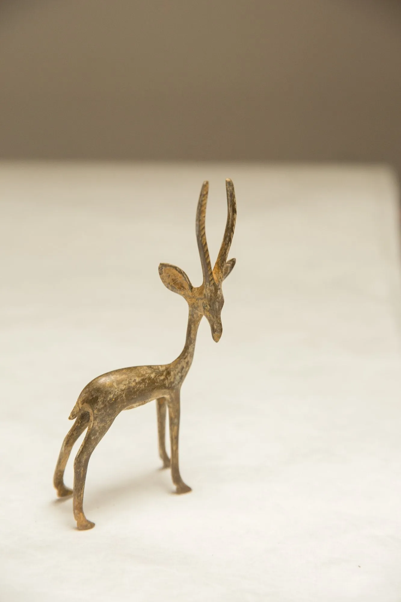 Vintage African Light Patina Turning Gazelle