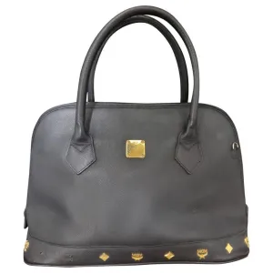 Vintage MCM black bolide style bag with gold tone metal studded charms. Rare masterpiece purse for unisex use. Phenomenon