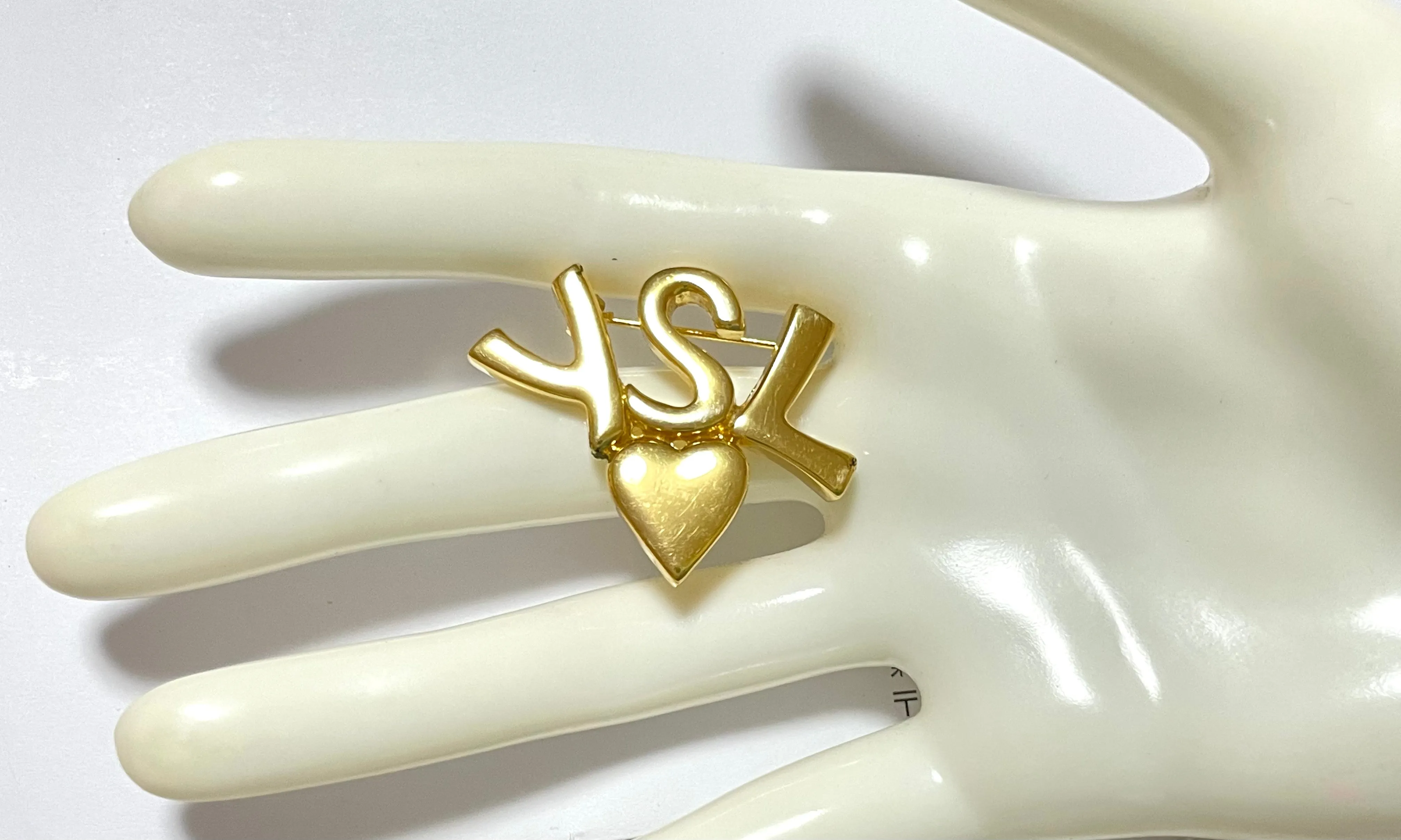 W2 Vintage Yves Saint Laurent classic YSL logo and heart brooch. Perfect pin for hat, scarf, jacket etc. Great gift.0408173