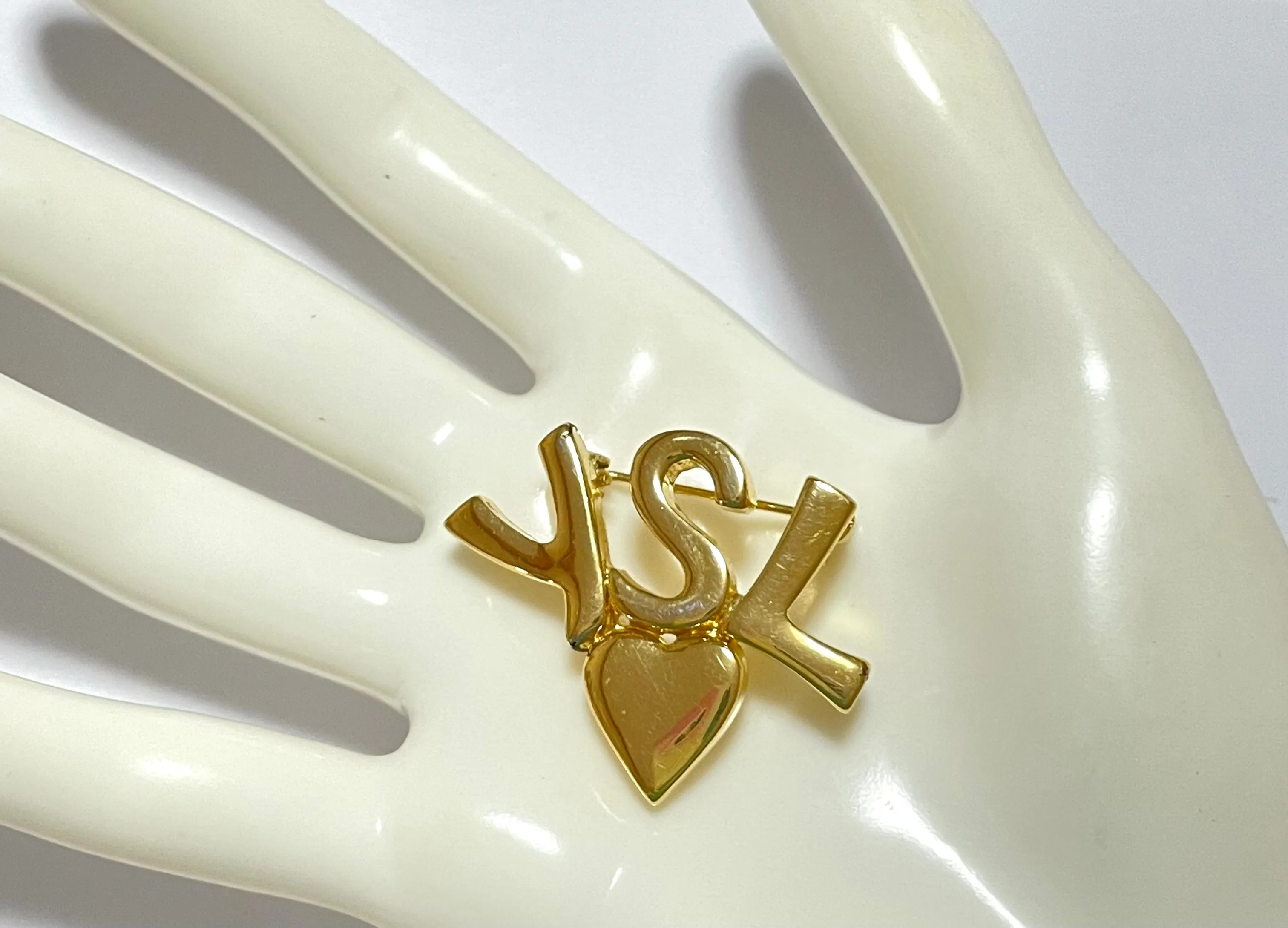 W2 Vintage Yves Saint Laurent classic YSL logo and heart brooch. Perfect pin for hat, scarf, jacket etc. Great gift.0408173